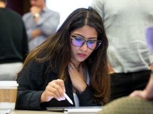 Working professional in a part-time MBA while working full time, balancing career growth with graduate studies.