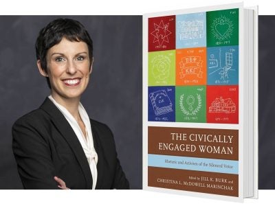 A headshot of a woman with short hair in a suit, next to an enlarged image of a book with a colorful cover.