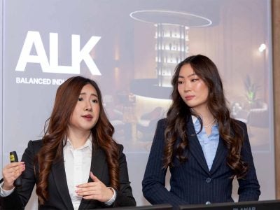 Katelynn Wiseman and Miya Deng, seniors in the Nolan School of Hotel Administration, present their startup, ALK.