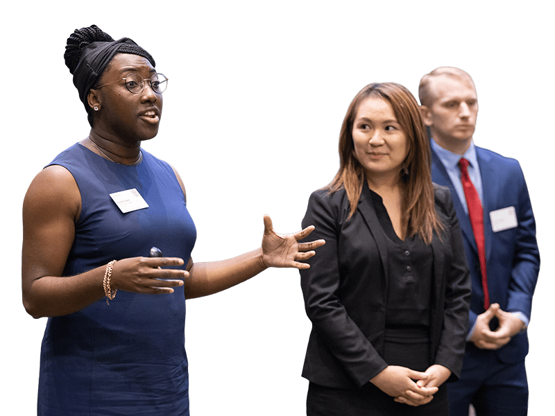 Three students presenting during an MBA Case Competition.