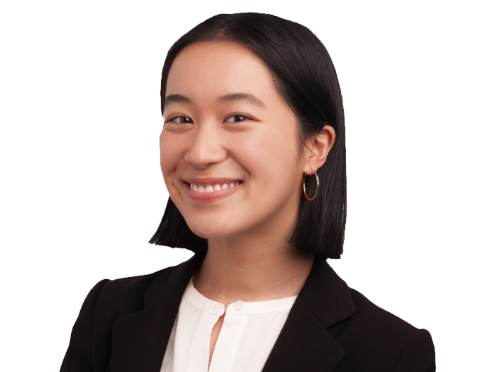 portrait of Eri Kato, a Cornell Nolan School undergraduate, smiling in business formal attire