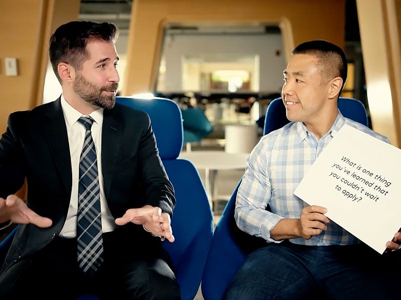 Screen grab from video of two people in mid discussion.