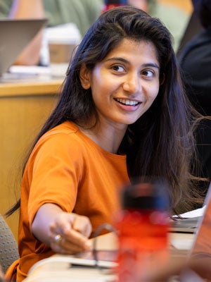 Business analytics student engaged in a classroom discussion.
