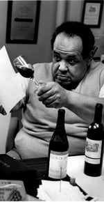 Vance Christian examining the color of wine in a wine glass