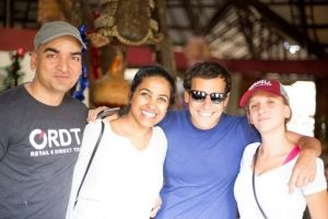 Photo of four smiling MBAs on the South Africa trek