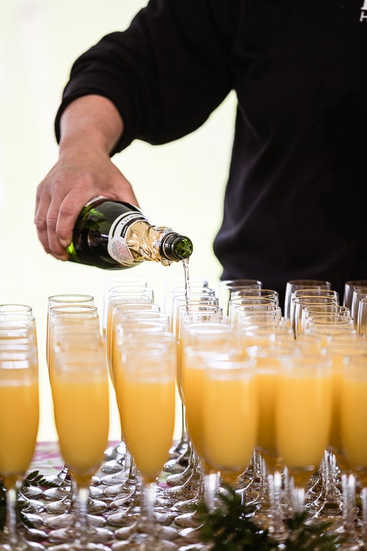 Photo of mimosas being poured