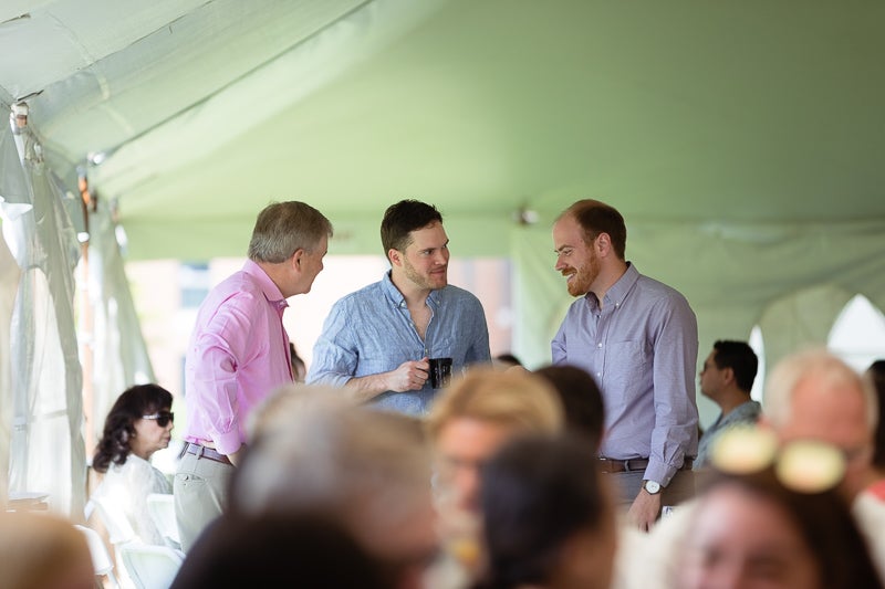 Photo of three men talking