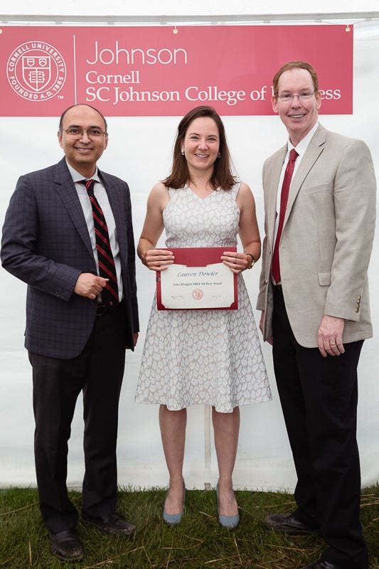 Photo of Lauren holding a certificate