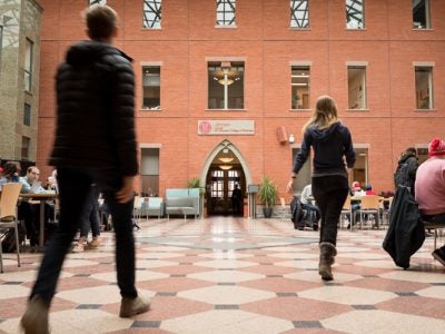 Students walking through Sage Hall