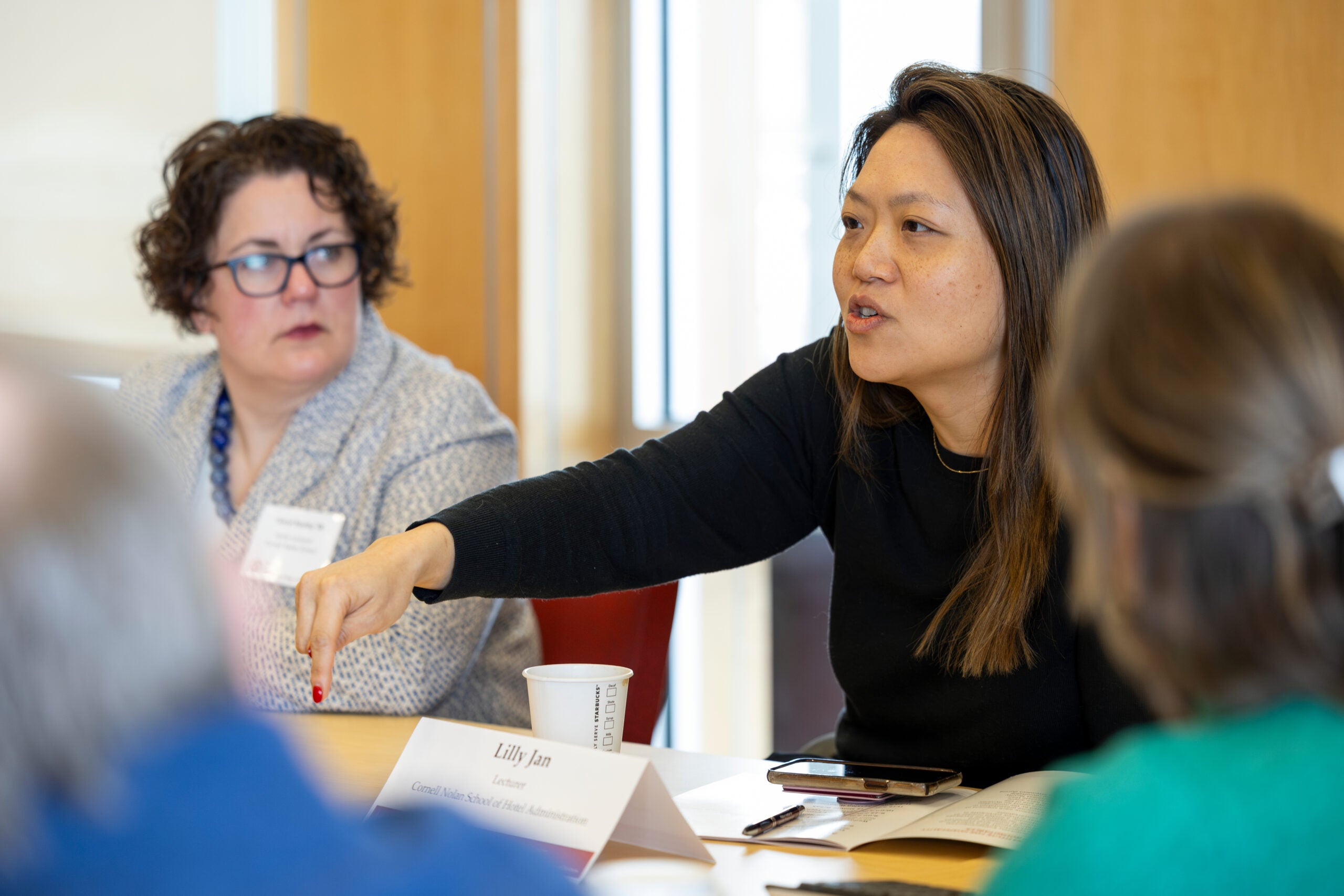 Picture of Lilly Jan participating in discussion.
