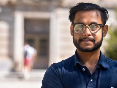 Image of Talha Islam ’24 in front of Warren Hall