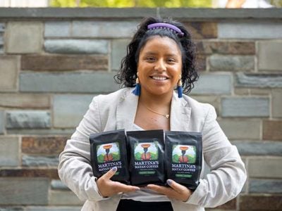 Martina Pablo Pablo in the Beck Center Atrium with the Mayan coffee she is roasting in Ithaca.