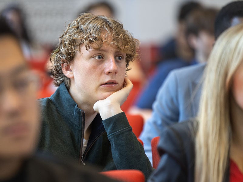Student listening to classroom expert