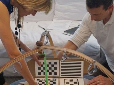 A female and male testing an early prototype of the business&rsquo; first product: the Play Gym