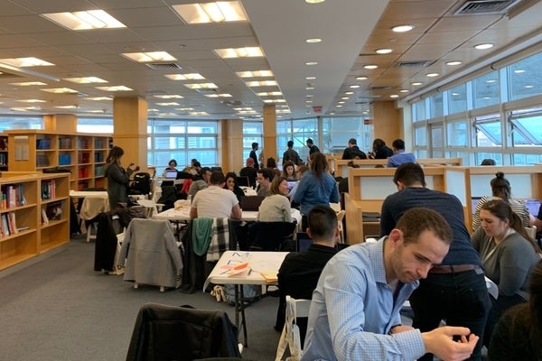 Students working in teams in a library