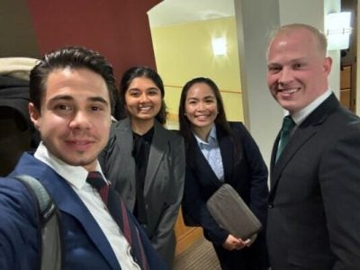 four students in business attire