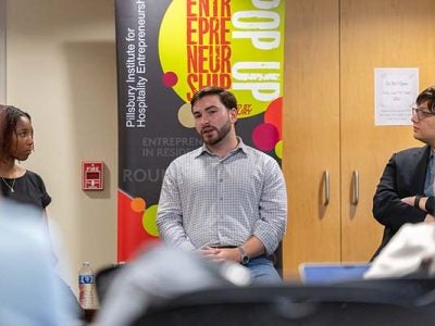 Image of Rob Karp ’19 speaking to Air & Sea Club students