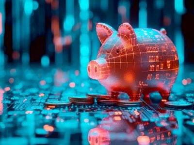 A piggy bank standing on gold coins placed on a computer motherboard