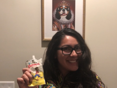 photo of Alanna Miyajima smiling and holding Danimals yogurt in her right hand