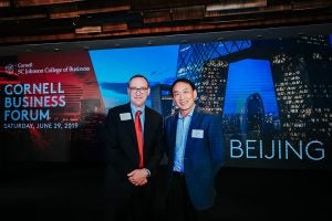 Kevin Hallock, dean of the Cornell SC Johnson College of Business, with guest speaker Gang Yu, MS &rsquo;86, co-founder of grocery e-commerce platform Yihaodian and of healthcare platform 111 Inc.