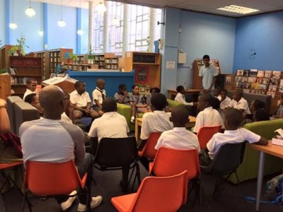 Me speaking to high school students during my book tour stop in South Africa last year.
