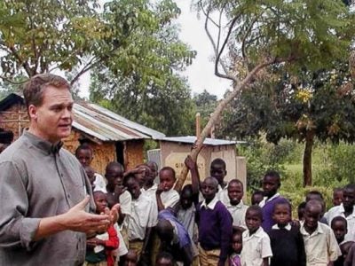 Photo of Chris Barrett with children in Africa. Credit: Chris Barrett