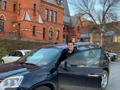 Colin Lang, Two-Year MBA '20, outside Sage Hall in his Acadia
