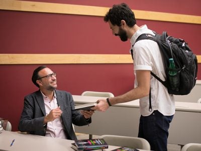 Photo of Damian Mogavero with a student at his book signing
