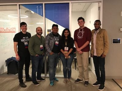 Photo of Donnie Hampton and teammates at the fintech hackathon
