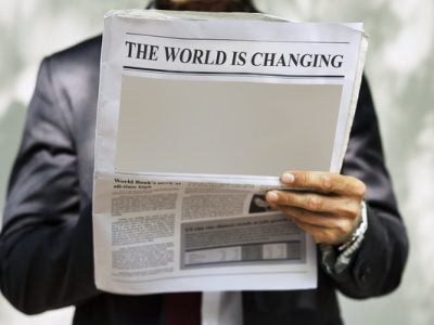 A person reading a newspaper