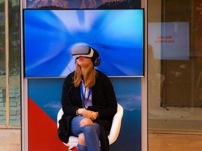 Photo of a women using virtual reality goggles