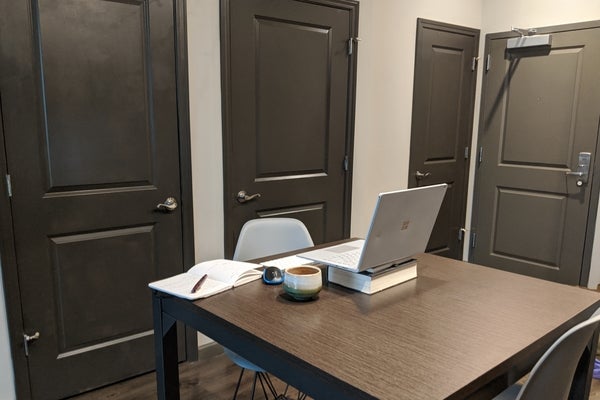 A picture of Anshul&rsquo;s desk and computer in a very simple room