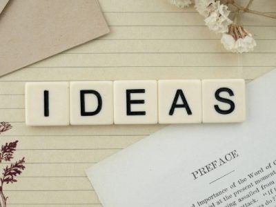 the word ideas spelled in letter tiles