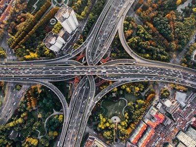 overhead photo of a multi-layered highway cloverleaf.