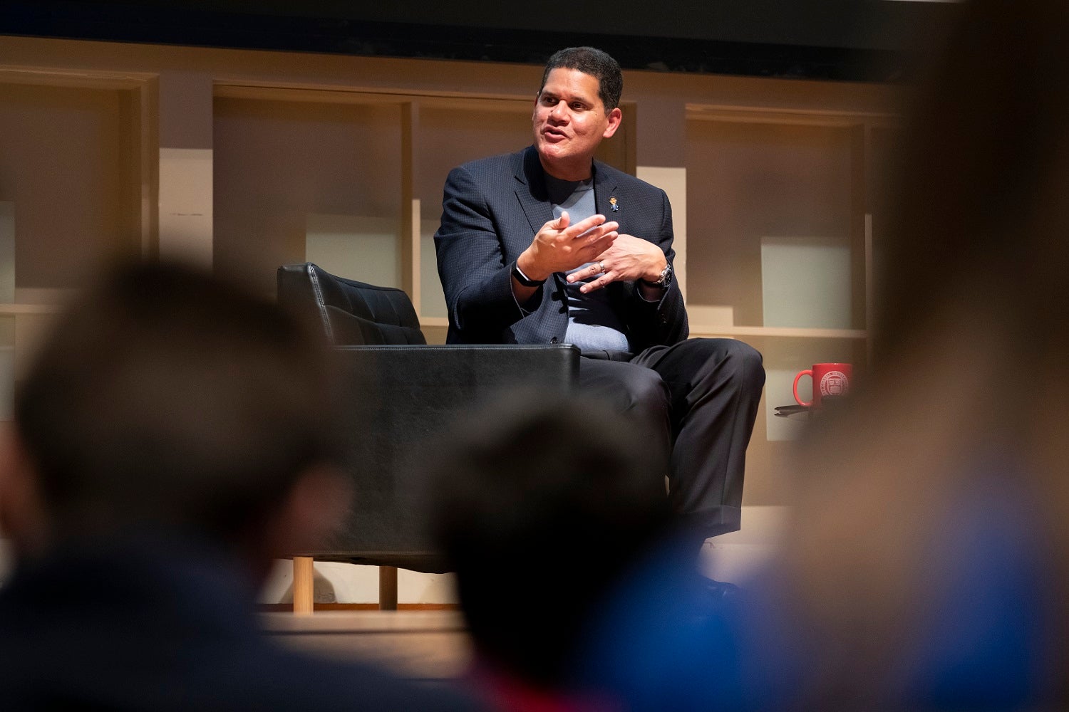 Reggie leads a discussion from on stage