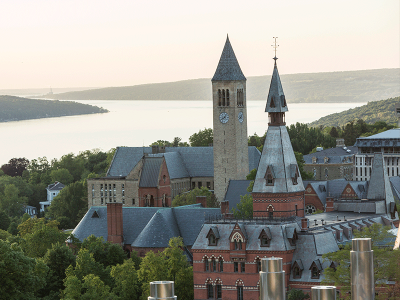 Aerial view of Ithaca campus with lake and clock tower