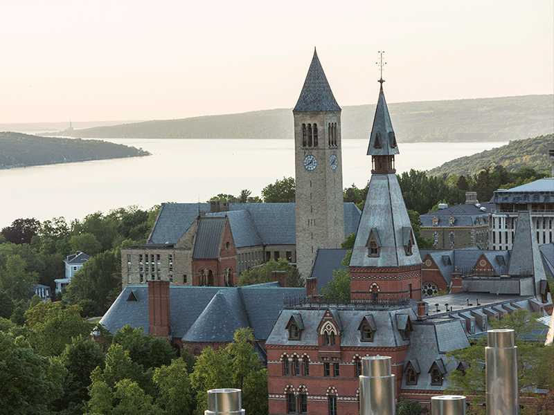 Aerial view of Ithaca campus with lake and clock tower