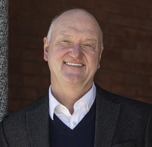 Headshot of Dean Andrew Karolyi.