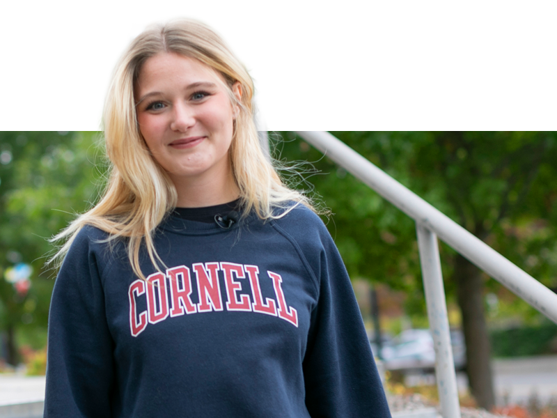 CEMS students holding cornell bottle.