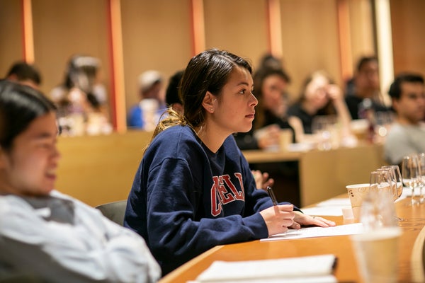 A student listens to Miller in class