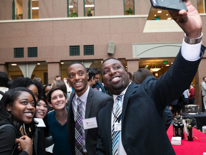 Johnson Means Business participants take a selfie in the atrium.