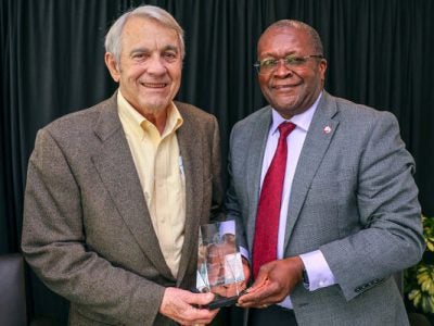 Image of Lynden Archer, right, the Joseph Silbert Dean of Engineering, presenting James C. Morgan ’60, MBA ’63 with the Cornell Engineering Distinguished Alumni Award.