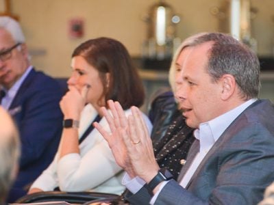 Roundtable attendees in discussion at a table