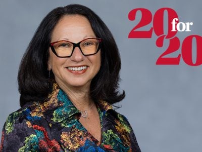 Headshot of Linda Giuliano with a 20 for 20 graphic identifier overlaid on the photo background.