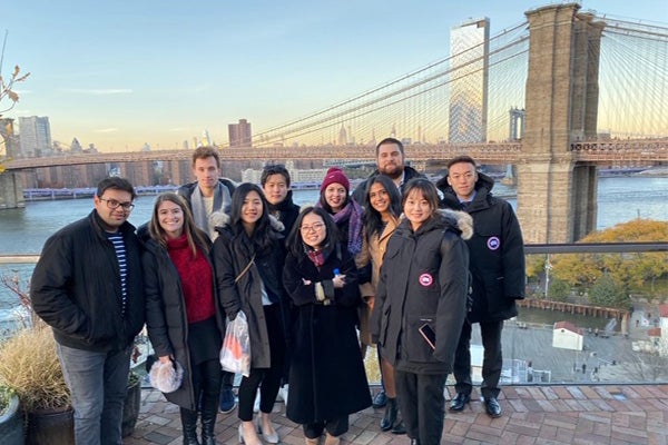 MMH students stand in front of the Brooklyn Bridge.