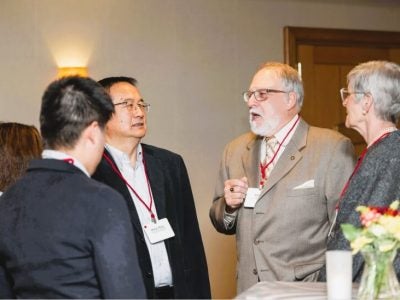 Meng Zhou, M.S. ’92, Ph.D. ’96, and his doctoral advisor, E.V. Baker Professor of Agricultural Economics Emeritus Andrew Novakovic.