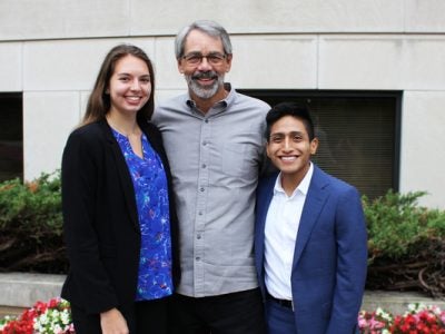 Emma Moulton and Wellington Lema with Dave Evans