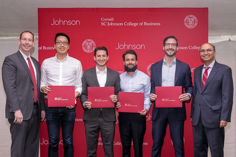 Marketing case competition winners with their awards