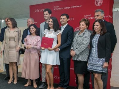 Guests and students pose for a photo