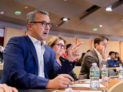 Jason Spillerman &rsquo;92, co-founder and principal of Vibrant Development Group, sits with fellow judges and gives feedback to a presenter.